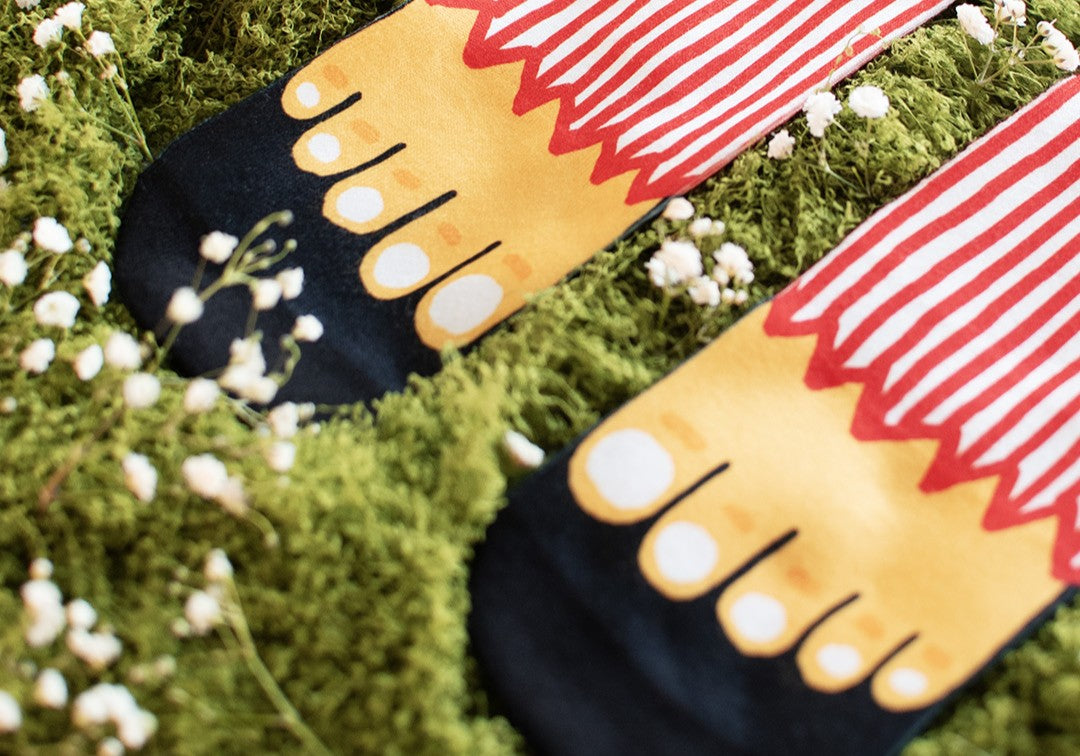 A pair of colorful socks designed by American Socks, symbolizing support for the homeless through the Pisadas Visibles initiative.